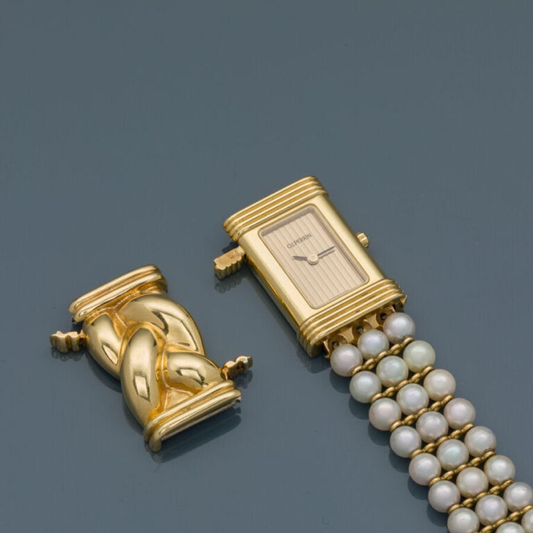 O.J. PERRIN - BRACELET MONTRE de dame rectangulaire en or jaune (750‰). Lunette…