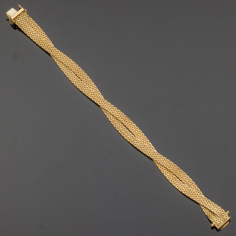 BRACELET en or jaune (750‰) à maille double plate torsadée - Long. : 19 cm. Lar…