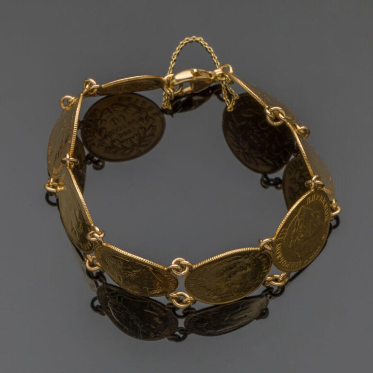 BRACELET en or jaune (750‰) composé de huit pièces de 10 FF en or (900‰) compre…