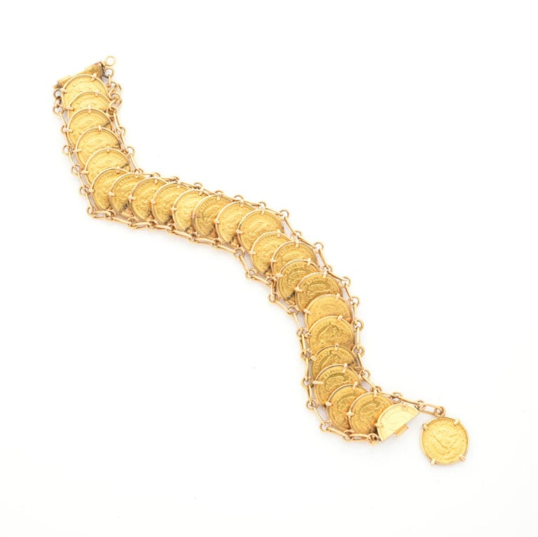 Bracelet en or jaune (750) orné de 24 pièces de 2 pesos - Long : 18 cm - Poids…