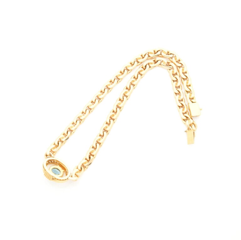 COLLIER en or jaune (750‰) à maille gourmette limée ovale centrée d'un médaillo…