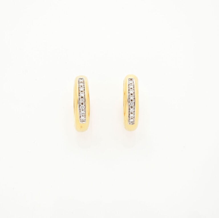 Paire de BOUCLES d'OREILLES "créoles" en or jaune et or gris (750‰) serti d'un…