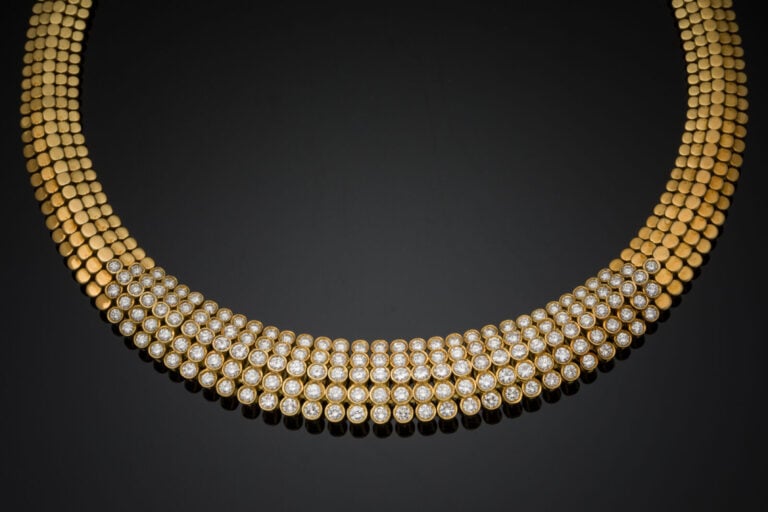 DEMI-PARURE comprenant un COLLIER et un BRACELET, souple, or jaune (750‰) à mot…