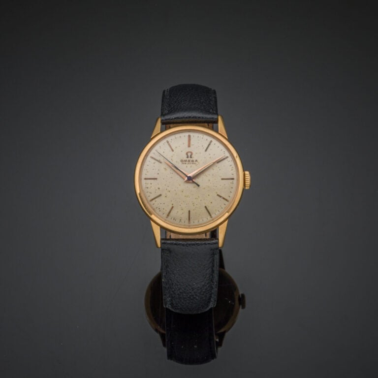OMEGA - BRACELET MONTRE ronde en or jaune (750‰). Cadran doré (taches), index a…