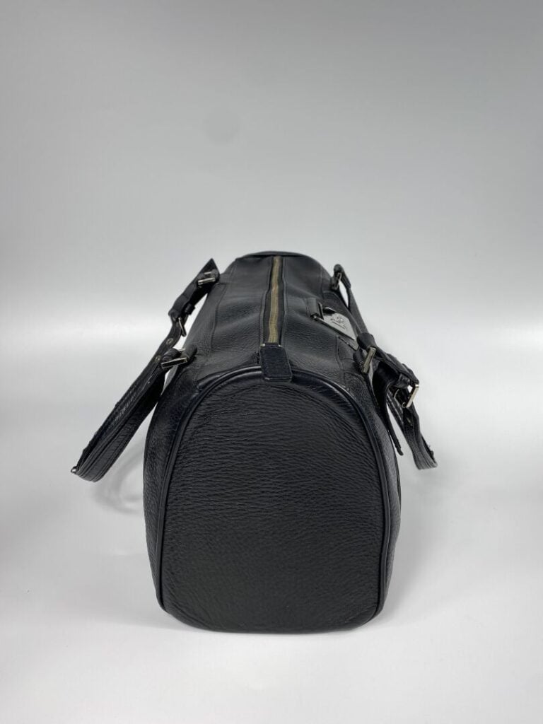CHRISTIAN DIOR - Sac bowling en cuir grainé noir, double anse, plaque en métal…
