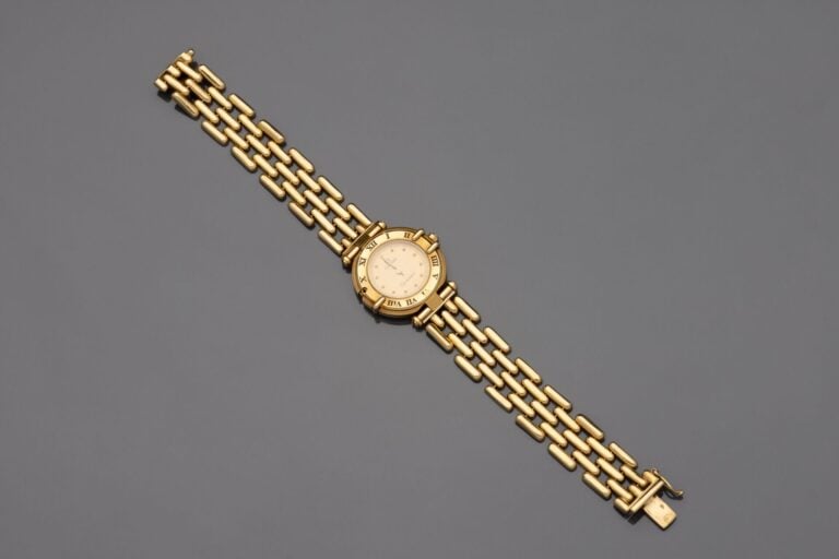 OMEGA - BRACELET MONTRE ronde " Constellation " de dame en or jaune (750). Lune…