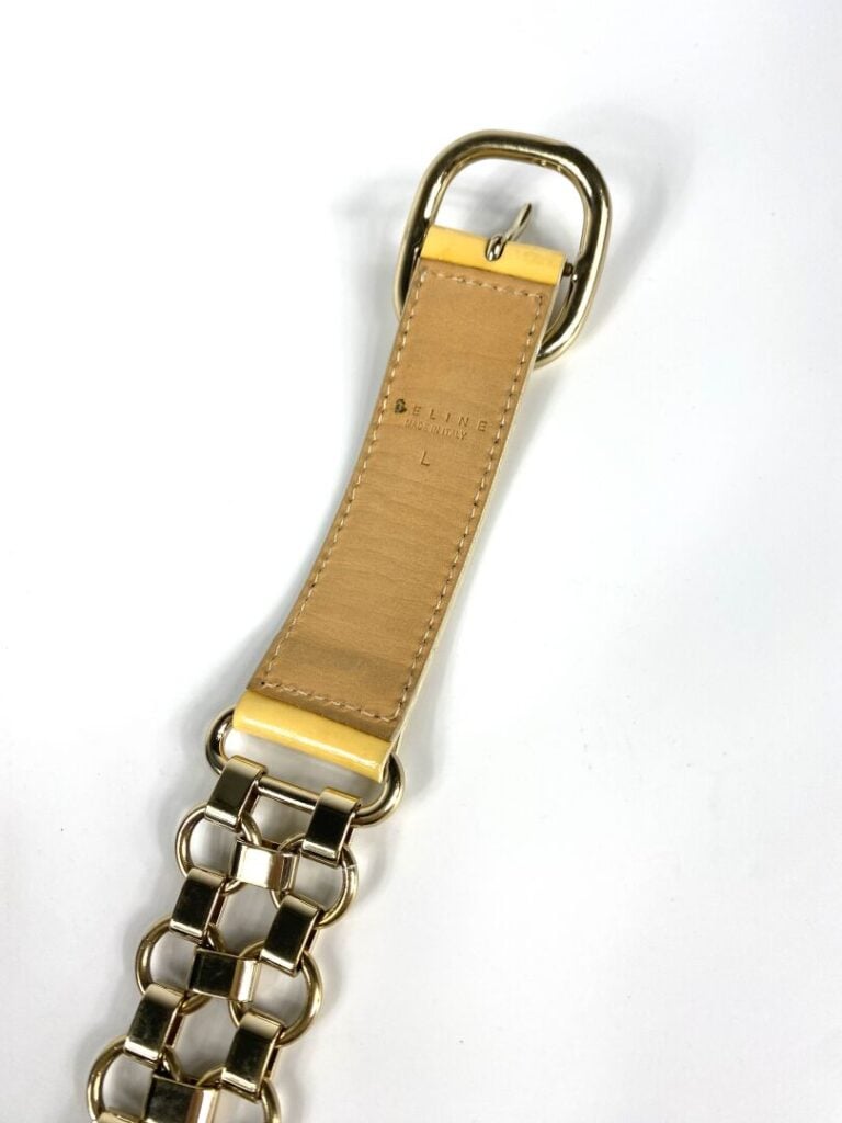 CÉLINE - Ceinture en cuir verni beige entrecoupé de maillons en métal doré (Tai…