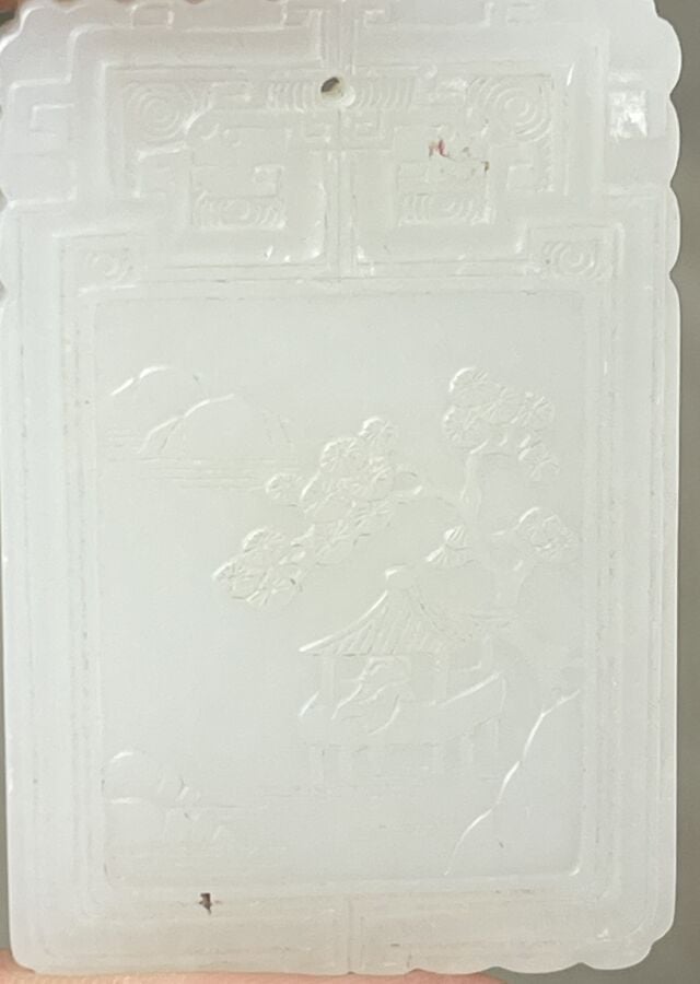 CHINE - XIXème siècle - PENDENTIF rectangulaire en jade blanc à décor en léger…