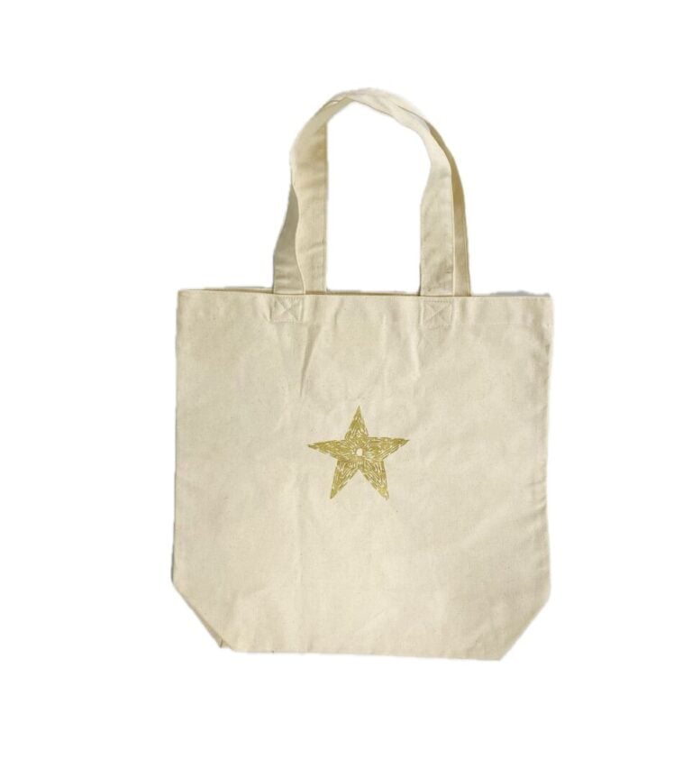 CHRISTIAN DIOR (2017) - Tote bag en toile de coton beige imprimée doré "We are…
