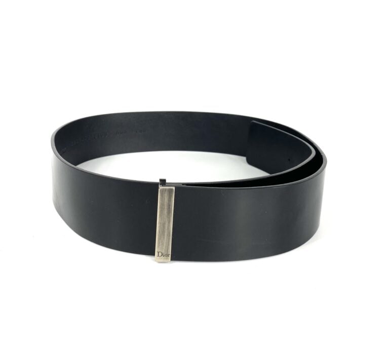 CHRISTIAN DIOR, circa 2000 - Lot de deux ceintures en cuir glacé noir et métal…