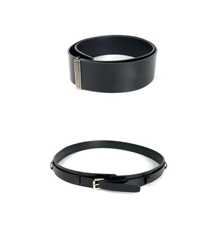 CHRISTIAN DIOR, circa 2000 - Lot de deux ceintures en cuir glacé noir et métal…