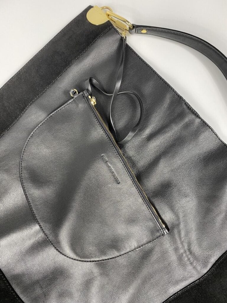 DIANE VON FURSTENBERG - Cabas plat en agneau plongé et daim noir, pochette inté…