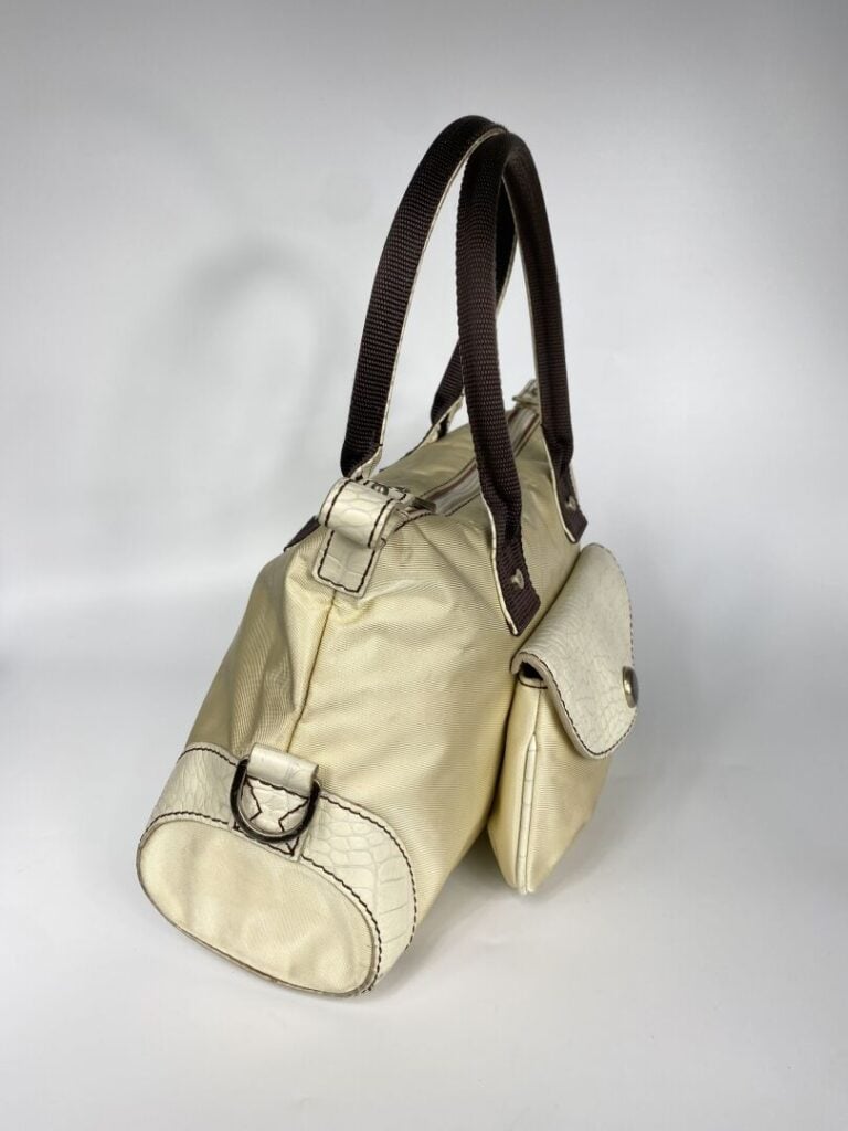 LANCEL - Sac en tissu beige et cuir crème façon reptile, porté main, double ans…
