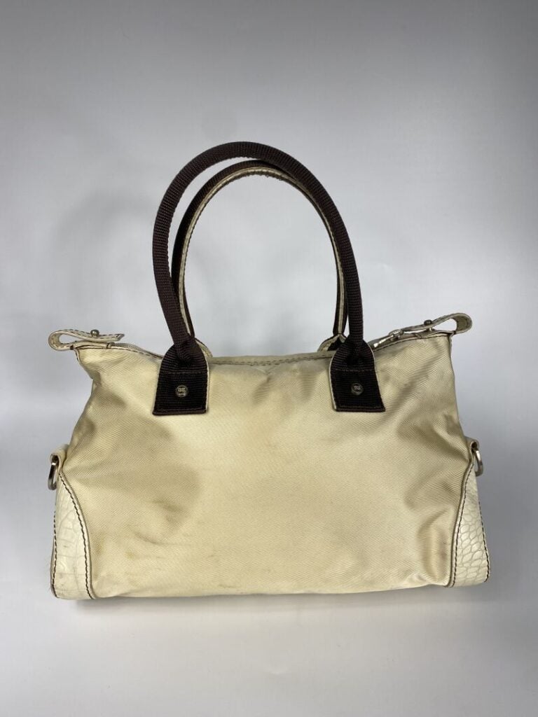 LANCEL - Sac en tissu beige et cuir crème façon reptile, porté main, double ans…