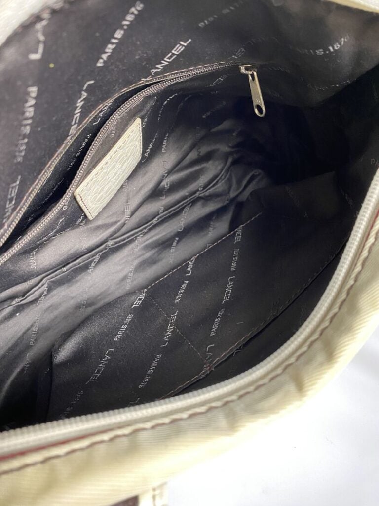 LANCEL - Sac en tissu beige et cuir crème façon reptile, porté main, double ans…