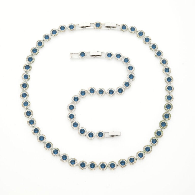 SWAROVSKI - Demi-parure comprenant un collier et un bracelet en métal argenté à…