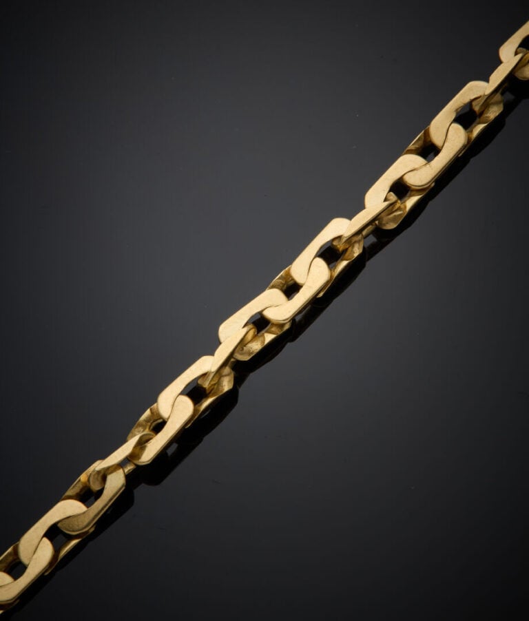 BRACELET en or jaune (750‰) à maillons plats ovales. - Long.: 18 cm. Poids : 12…