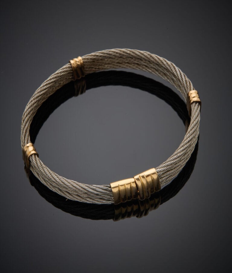 BRACELET rigide ouvrant composé de câbles d'acier torsadés, fermoir et attaches…