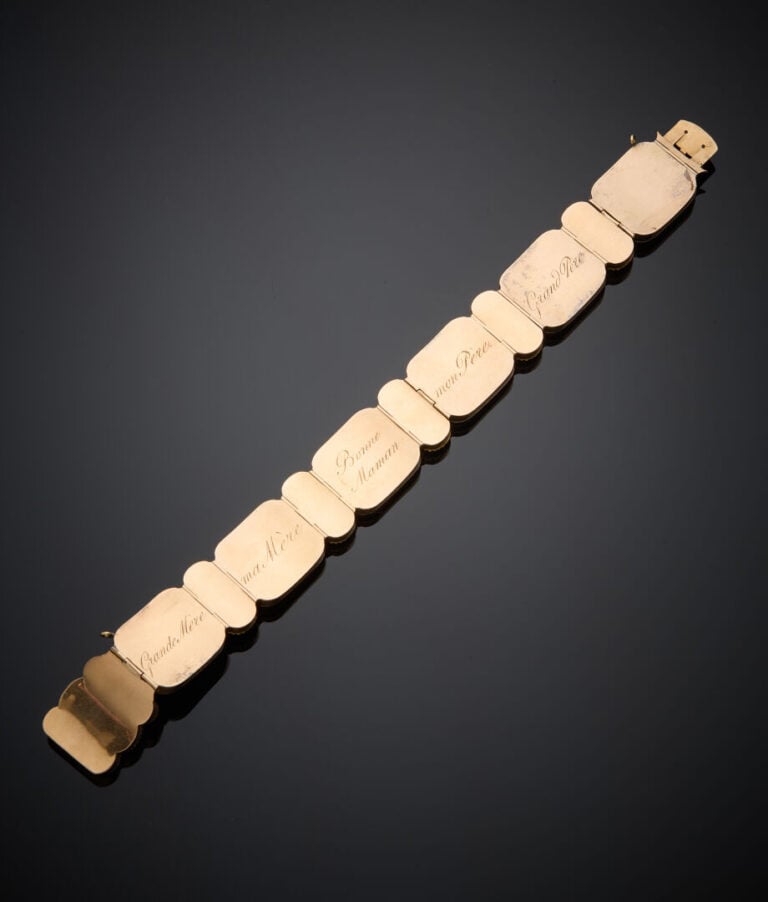 BRACELET "sentimental" articulé en or jaune et or gris (>375‰) bas titre, amati…