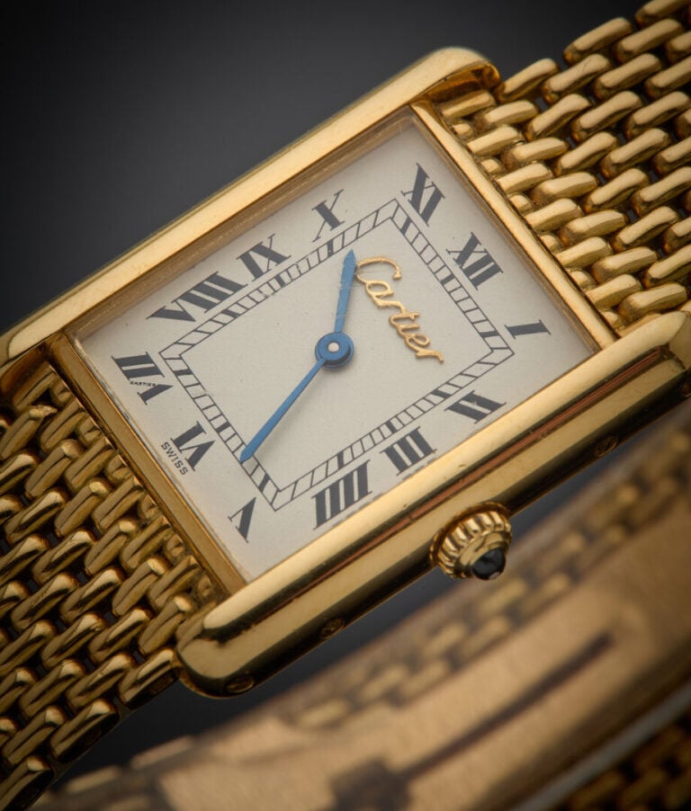 CARTIER - - BRACELET MONTRE rectangulaire, modèle "Tank" en or jaune (750‰). Ca…