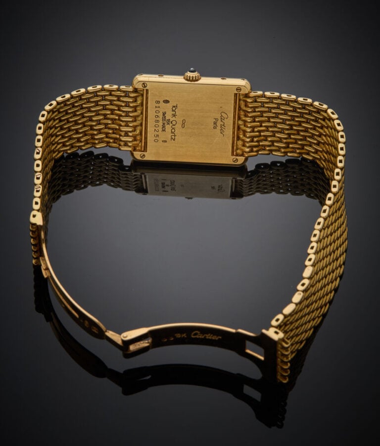 CARTIER - - BRACELET MONTRE rectangulaire, modèle "Tank" en or jaune (750‰). Ca…