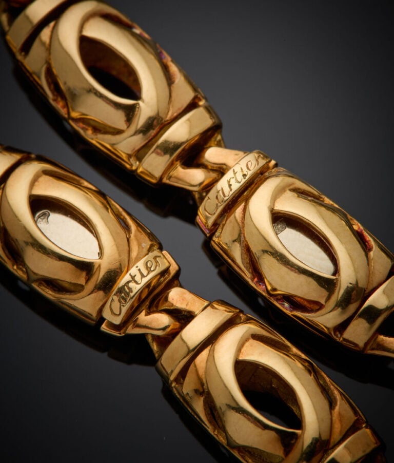 CARTIER - - DEMI-PARURE en or rose (750‰) ajouré, composée d"un COLLIER et un B…