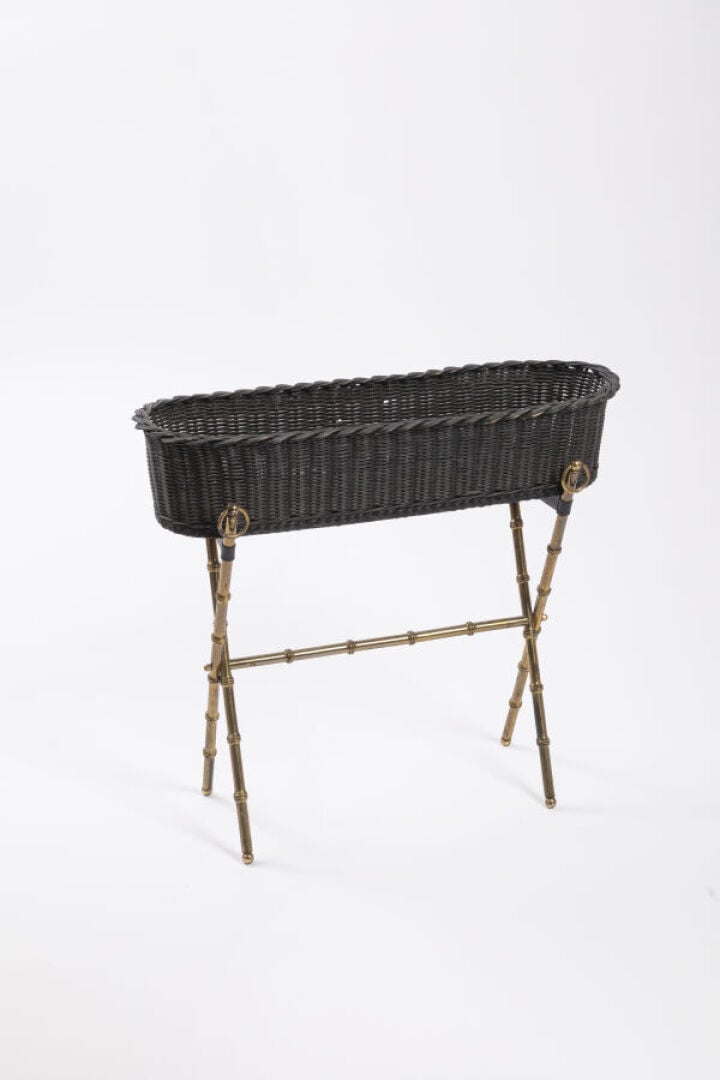JACQUES ADNET (1901-1984) - Jardinière en osier teintée noire, piètement en mét…