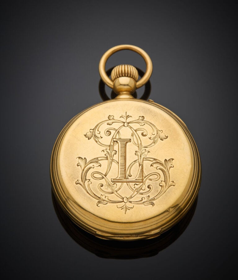MONTRE de POCHE en or jaune (750‰) monogrammé "L". Cadran émail blanc, chiffres…