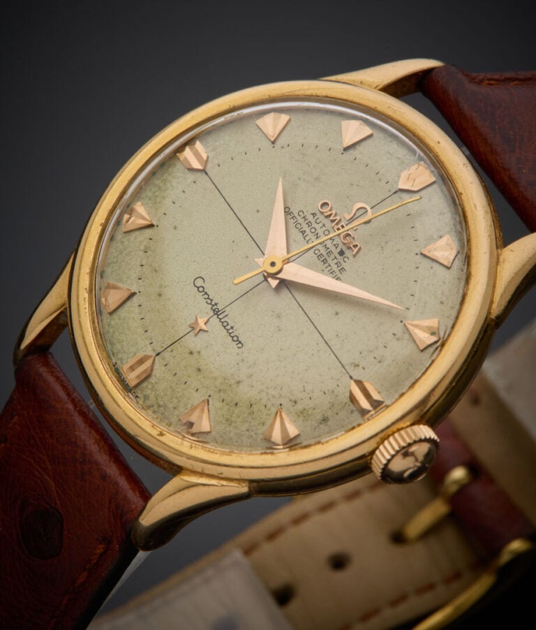 OMEGA - - BRACELET MONTRE ronde "Constellation" en or jaune (750‰). Cadran crèm…