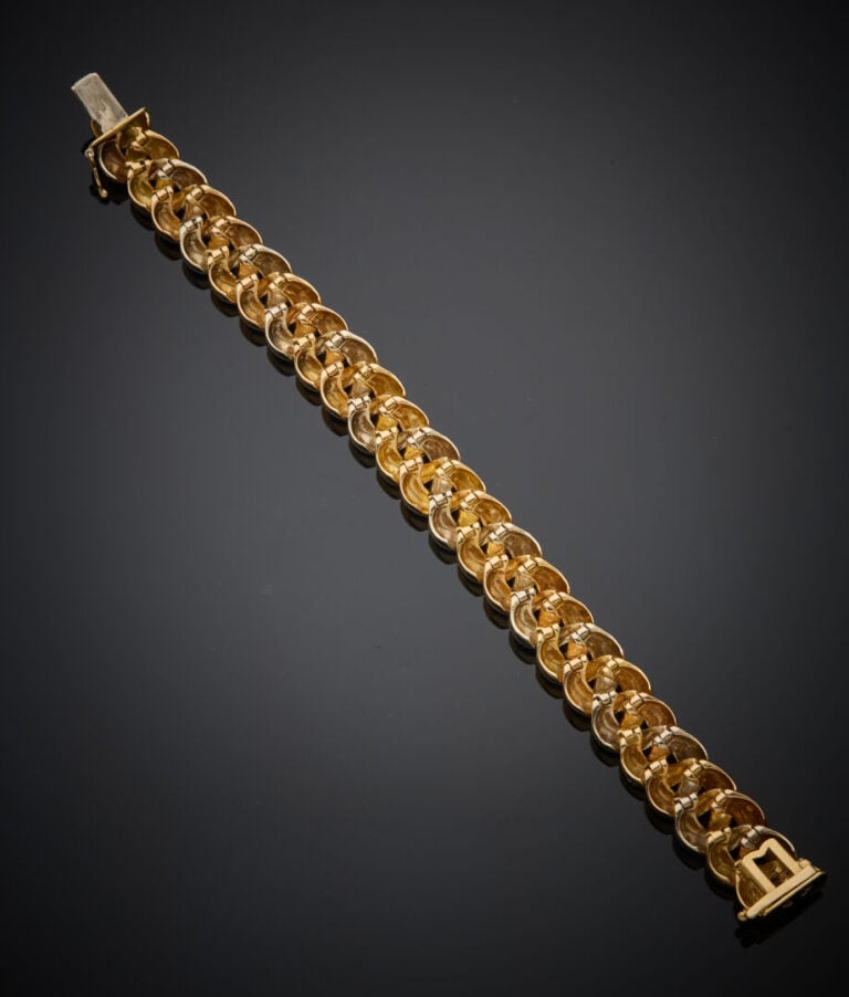 POIRAY - - BRACELET "tresse" trois ors (750‰) godronnés. - - Travail français.…