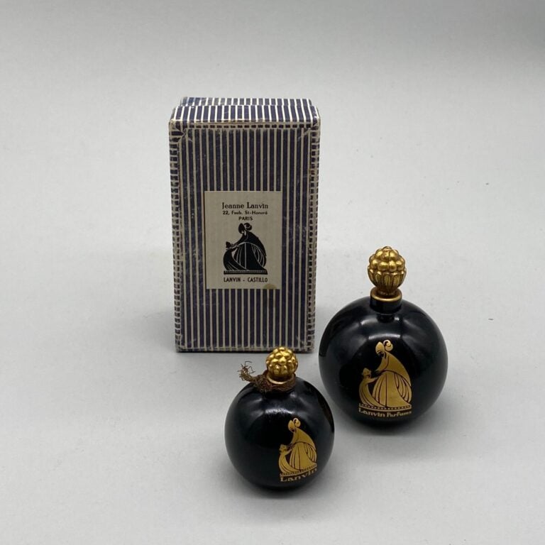 LANVIN, pour "Amorato", 2 flacons boule noire , à bouchon framboise émeri, logo…