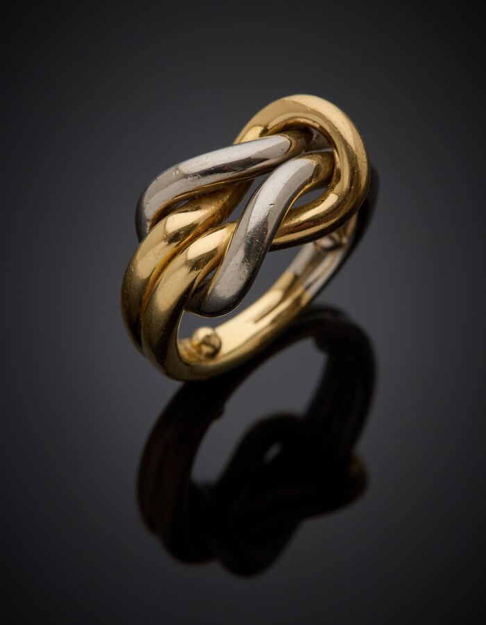 CARTIER - Importante BAGUE "nœud" en or jaune et or gris (750‰) ajouré. - Signé…