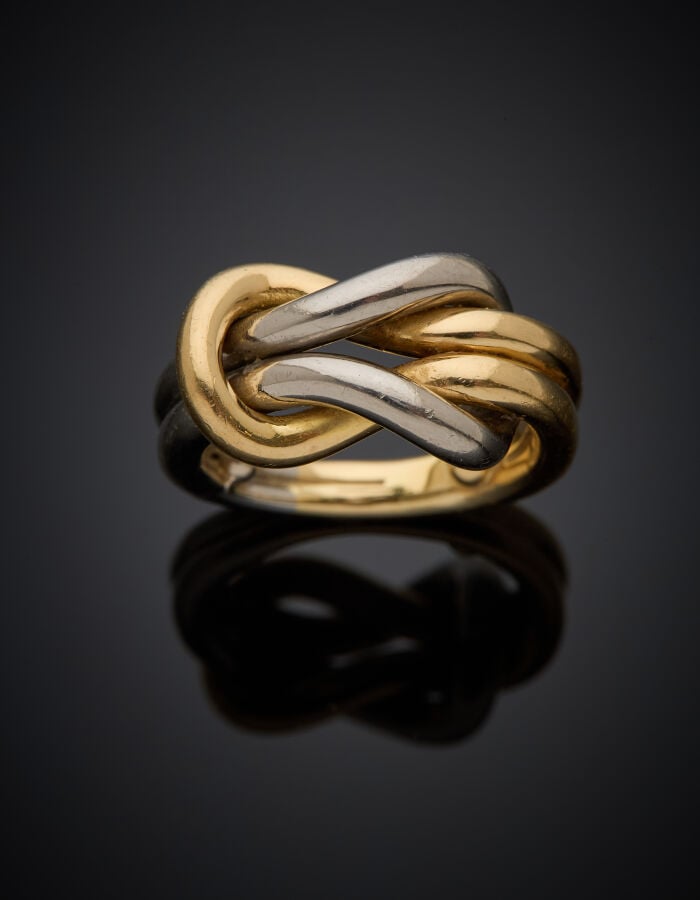CARTIER - Importante BAGUE "nœud" en or jaune et or gris (750‰) ajouré. - Signé…