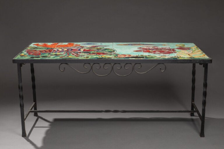 CER ART MONACO - Une table basse en céramique émaillée représentant un paysage…
