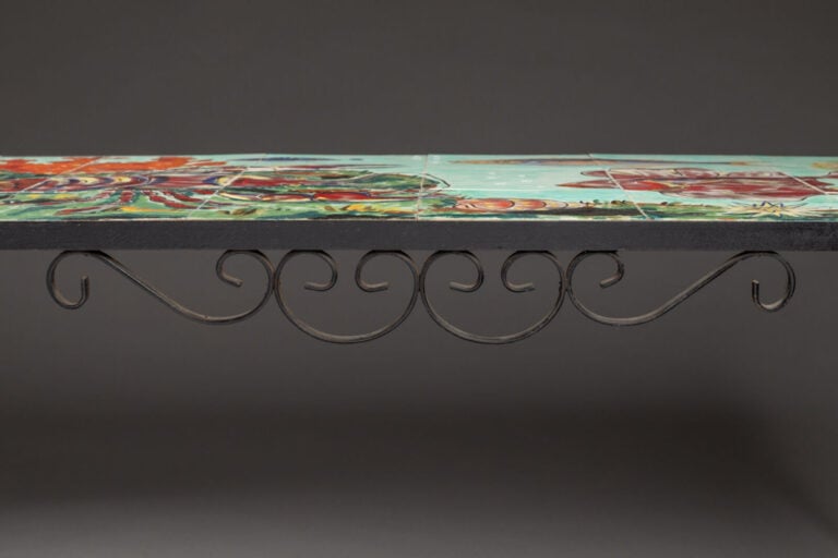 CER ART MONACO - Une table basse en céramique émaillée représentant un paysage…