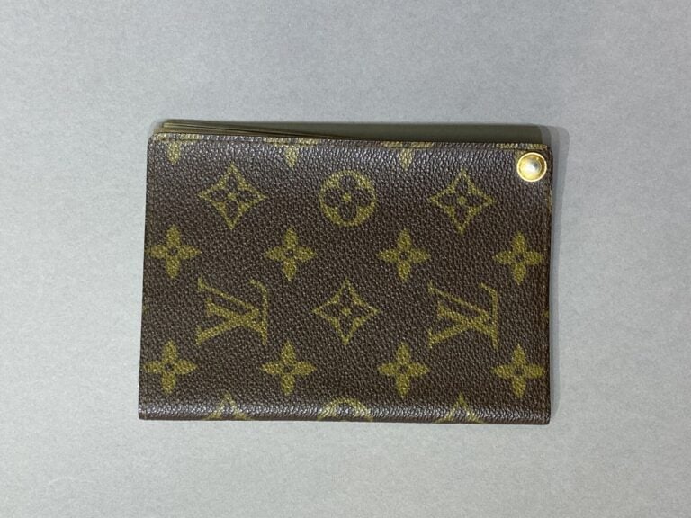 LOUIS VUITTON - Porte-photos en toile monogramm et cuir naturel, sept pochettes…