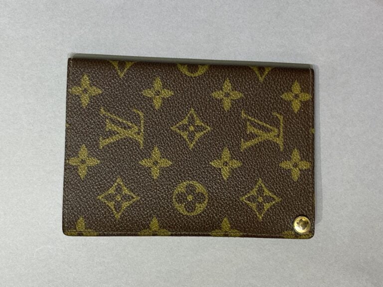 LOUIS VUITTON - Porte-photos en toile monogramm et cuir naturel, sept pochettes…