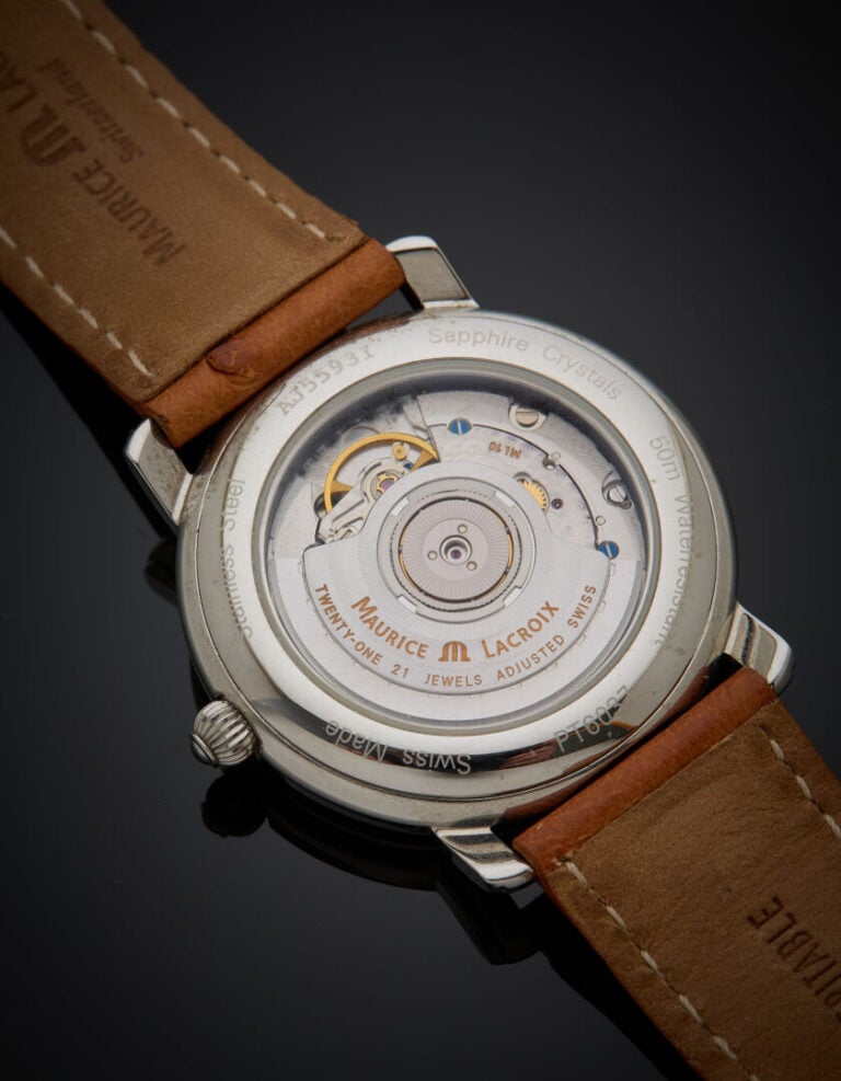 MAURICE LACROIX - BRACELET MONTRE "GMT" ronde en acier. Lunette et attaches god…