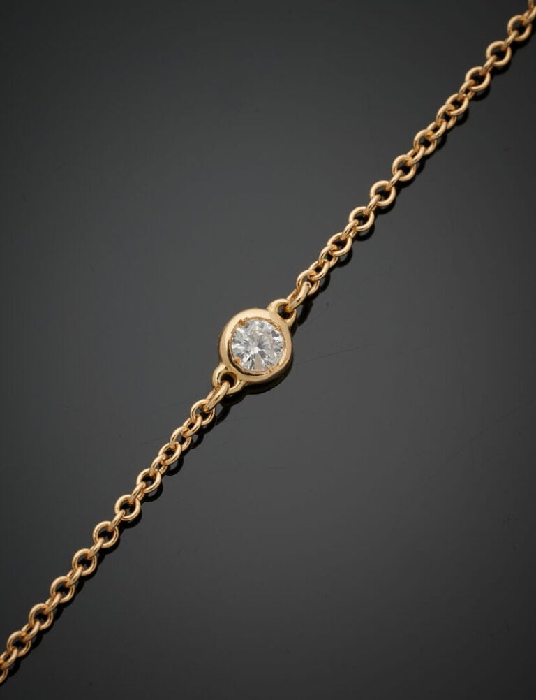 SAUTOIR en or jaune (750‰) serti de diamants taille brillant en serti clos. - L…