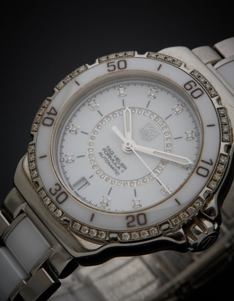 TAG HEUER - BRACELET MONTRE ronde de dame, modèle "Formula 1", en acier et céra…