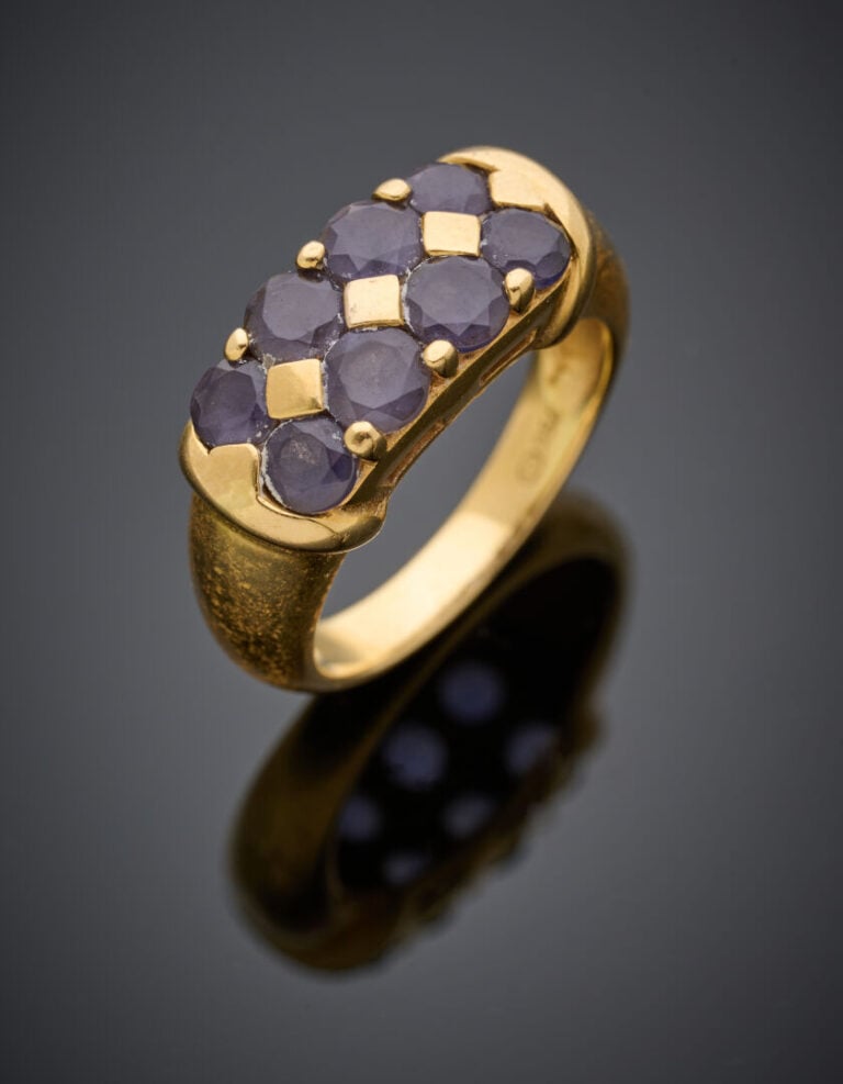 BAGUE en or jaune (750°/°°) serti de deux alignements de pierres d'imitation de…