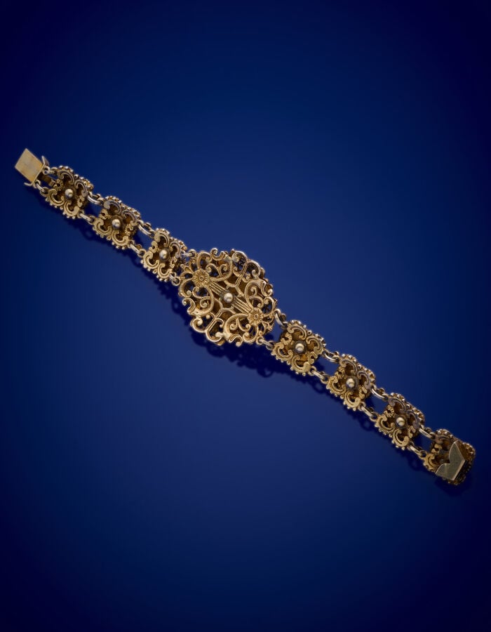 BRACELET articulé en vermeil (min. 800‰) ajouré torsadé et boulé, orné de huit…