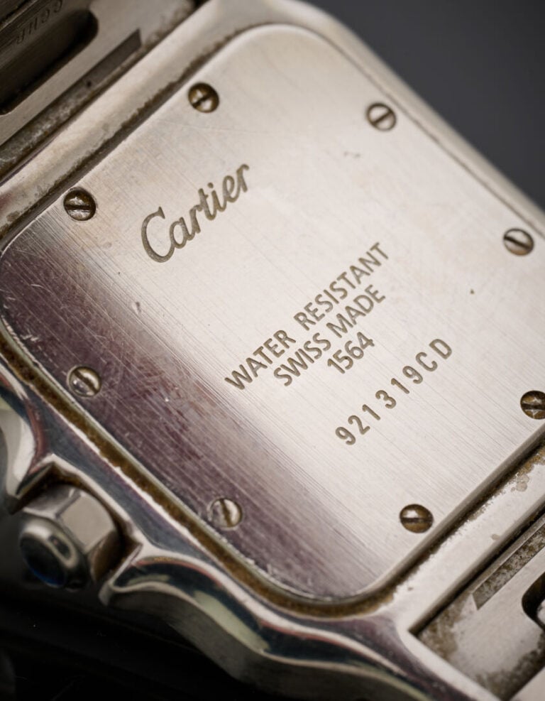 CARTIER - BRACELET MONTRE carrée en acier modèle "Santos". Lunette à vis, cadra…