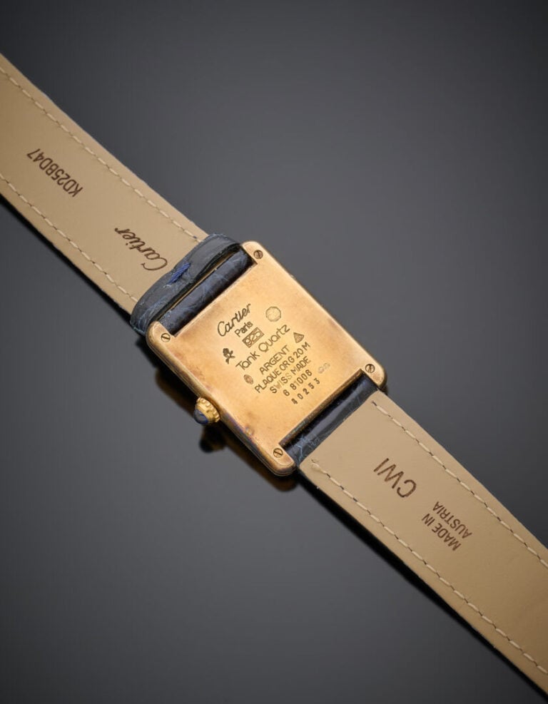 CARTIER - BRACELET MONTRE rectangulaire, modèle "Tank" argent (925‰) plaqué or.…