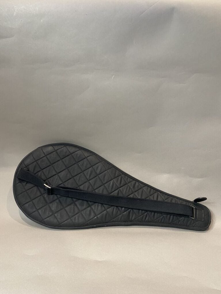CHANEL - Automne-Hiver 2011/2012 - Raquette de tennis noire rehaussée du sigle,…