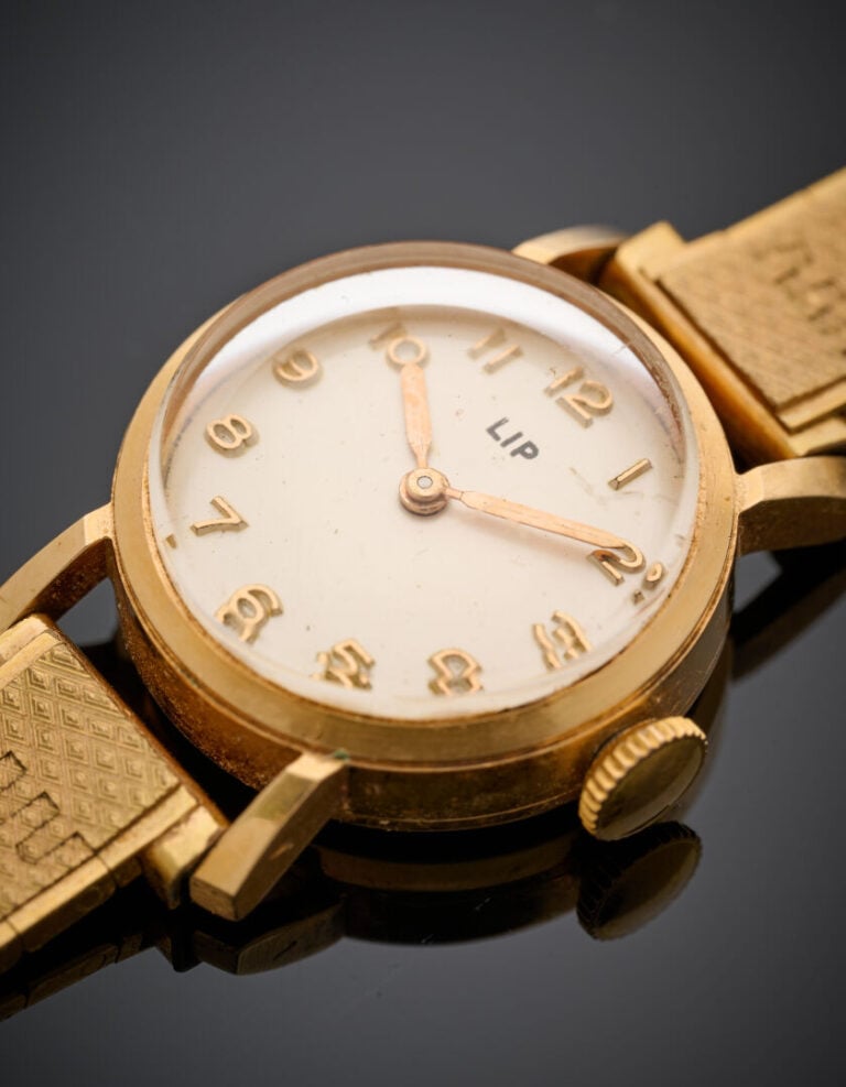 LIP - BRACELET MONTRE ronde de dame en or jaune (750°/°°). - Cadran crème, chif…