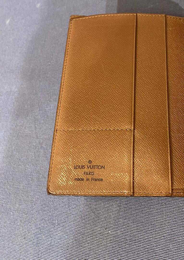 LOUIS VUITTON - Portefeuille en toile monogrammé, intérieur en cuir naturel, de…