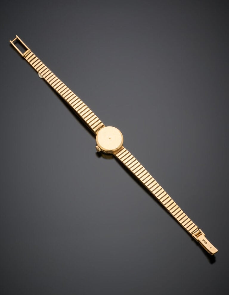 OMEGA - BRACELET MONTRE ronde de dame en or jaune (750‰). - Index bâtonnets. Us…