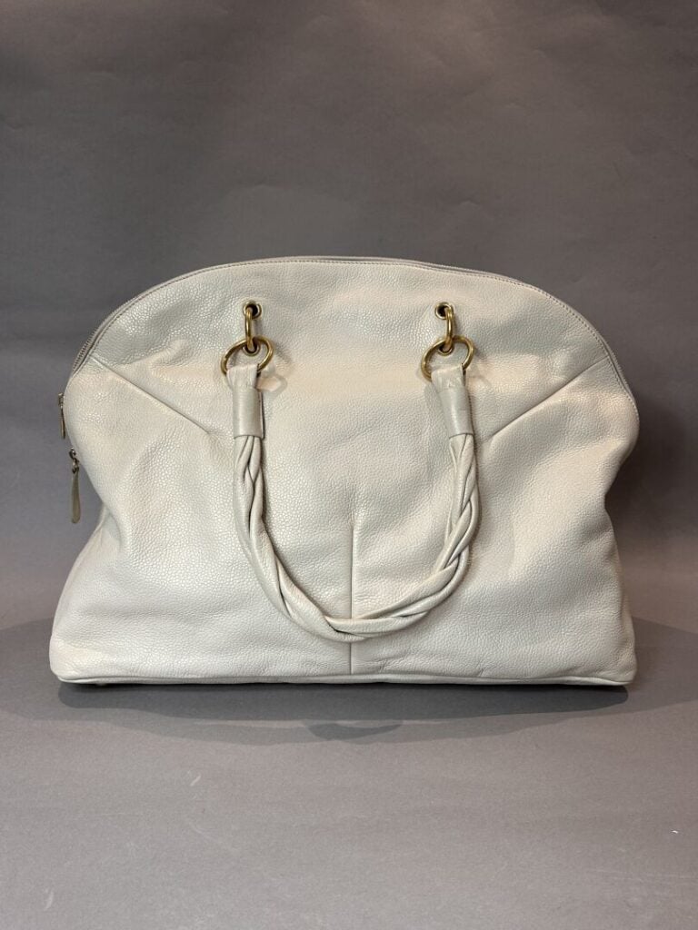 YVES SAINT LAURENT RIVE GAUCHE - Sac demi lune en cuir souple ivoire, fermeture…