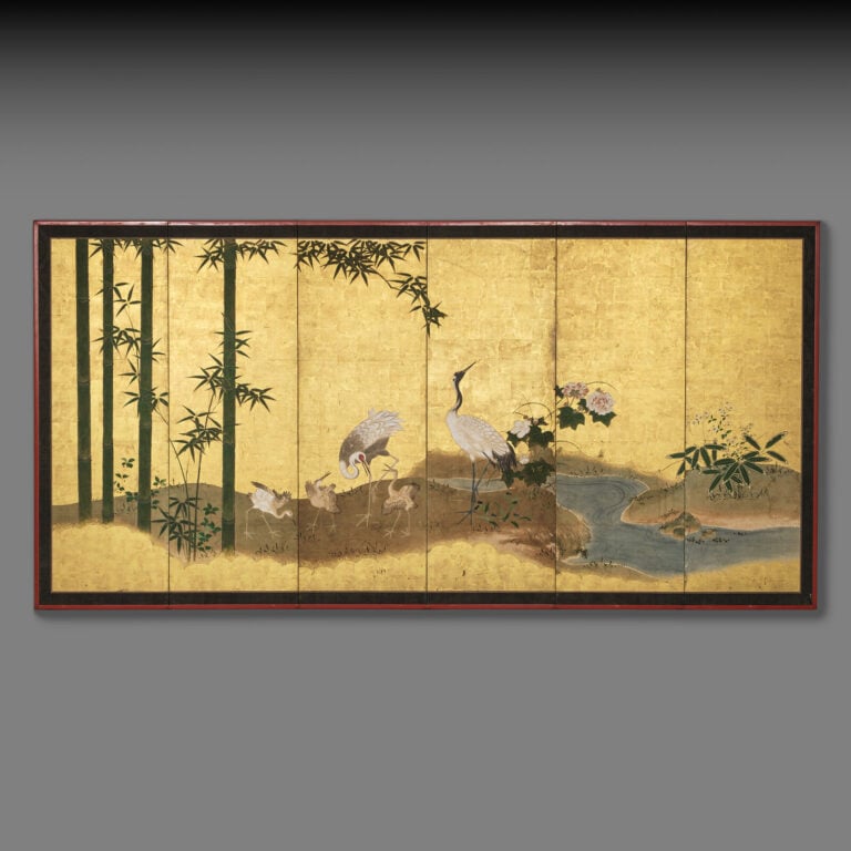JAPON - XVIIème siècle - Grand paravent à six panneaux à décor, sur fond de feu…